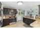 Well-equipped kitchen with dark cabinetry, granite countertops, and stainless steel appliances at 878 Cold Springs Rd, Concord, NC 28025
