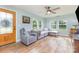 Inviting living room with a comfortable sectional sofa, ceiling fan, and natural light from windows at 878 Cold Springs Rd, Concord, NC 28025