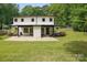 Spacious backyard featuring a covered patio and lush green lawn, perfect for outdoor enjoyment at 9305 Valley Rd, Charlotte, NC 28270