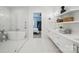 Stylish bathroom with modern fixtures, open shelving, and a walk-in shower at 9305 Valley Rd, Charlotte, NC 28270