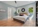 Airy bedroom featuring a stylish ensuite bathroom, light wood floors, and natural light at 9305 Valley Rd, Charlotte, NC 28270