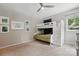 Bright bedroom featuring a cozy bunk bed and a calming atmosphere, perfect for restful nights at 9305 Valley Rd, Charlotte, NC 28270