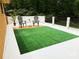 A private deck space perfect for relaxation or play with its mini putting green and cozy seating area at 9305 Valley Rd, Charlotte, NC 28270