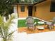 Private outdoor putting green deck with seating and a serene backyard view, creating a relaxing space at 9305 Valley Rd, Charlotte, NC 28270