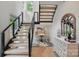 Beautiful staircase with modern railings, complemented by a desk and a vanity at 9305 Valley Rd, Charlotte, NC 28270
