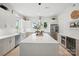 Bright kitchen offers stainless appliances, a large center island with decor, and plenty of counter space at 9305 Valley Rd, Charlotte, NC 28270
