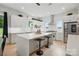 Bright, modern kitchen features a large island with seating, stainless steel appliances, and ample counter space at 9305 Valley Rd, Charlotte, NC 28270