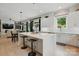 Open-concept kitchen with a spacious island, modern cabinetry, and a seamless connection to the living area at 9305 Valley Rd, Charlotte, NC 28270