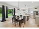 Modern kitchen with stainless steel appliances and a dining area with backyard views at 9305 Valley Rd, Charlotte, NC 28270