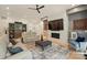 Bright living room featuring a fireplace, marble accent wall, and comfortable seating at 9305 Valley Rd, Charlotte, NC 28270