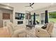 Open living space with fireplace, marble accent wall and backyard views at 9305 Valley Rd, Charlotte, NC 28270