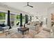 Bright, open-concept living area connected to the kitchen, featuring hardwood floors and natural light at 9305 Valley Rd, Charlotte, NC 28270