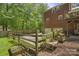 Well-maintained backyard featuring fenced yard with potting bench at 9707 Enid Ln, Matthews, NC 28105