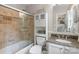 Full bathroom with a shower and tub combo with attractive tile at 9707 Enid Ln, Matthews, NC 28105