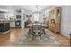 Inviting dining area with hardwood floors, elegant lighting, and easy access to the kitchen at 9707 Enid Ln, Matthews, NC 28105