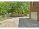 Spacious backyard with a detached garage, storage and fenced yard at 9707 Enid Ln, Matthews, NC 28105