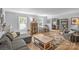 Bright and airy living room with hardwood floors, ample seating, and stylish decor at 9707 Enid Ln, Matthews, NC 28105