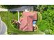 Aerial view showcasing a well manicured lawn, mature trees, and the home's roof at 1004 Berwick Ct, Waxhaw, NC 28173