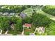 Aerial view of upscale homes, surrounding golf course, and lush landscape at 1004 Berwick Ct, Waxhaw, NC 28173