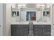 Stylish bathroom featuring double vanities, large mirrors, and modern lighting at 1004 Berwick Ct, Waxhaw, NC 28173