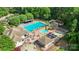 Aerial view of the community pool, featuring a water slide, ample seating, and multiple pools for all ages at 1004 Berwick Ct, Waxhaw, NC 28173