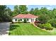 Charming home with well-manicured lawn, red roof, and a basketball hoop at 1004 Berwick Ct, Waxhaw, NC 28173