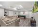 Spacious entertainment room featuring a billiards table, a comfortable sofa, and a drop ceiling at 1004 Berwick Ct, Waxhaw, NC 28173