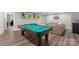 Entertainment room featuring a billiards table and a comfortable seating area, ideal for relaxation at 1004 Berwick Ct, Waxhaw, NC 28173