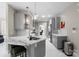 Modern kitchen with marble countertops, stainless steel appliances, and stylish gray cabinetry at 1004 Berwick Ct, Waxhaw, NC 28173