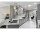 Elegant kitchen featuring marble countertops, gray cabinets, and stainless steel appliances at 1004 Berwick Ct, Waxhaw, NC 28173