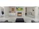 Bright living room with fireplace, marble floors, and views into office and dining spaces at 1004 Berwick Ct, Waxhaw, NC 28173