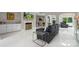 Spacious living room featuring marble floors, modern furniture, and a decorative fireplace at 1004 Berwick Ct, Waxhaw, NC 28173