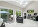 Bright living room with vaulted ceiling, skylights, and sliding doors to the patio at 1004 Berwick Ct, Waxhaw, NC 28173