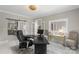 Home office with luxury lighting, large desk, and seating at 1004 Berwick Ct, Waxhaw, NC 28173