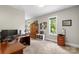Home office or bedroom featuring natural light, ample display space, and carpeted floors at 1004 Berwick Ct, Waxhaw, NC 28173