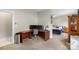 Functional home office or bedroom includes built-in desk and adjacent bedroom area at 1004 Berwick Ct, Waxhaw, NC 28173