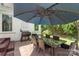 Outdoor patio with dining set, BBQ grill, and lush backyard, great for gatherings at 1004 Berwick Ct, Waxhaw, NC 28173