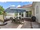 Outdoor patio with dining set, hot tub, and grill, perfect for entertaining at 1004 Berwick Ct, Waxhaw, NC 28173