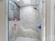 Gorgeous marble shower with built-in bench, rainfall showerhead, and handheld sprayer at 1004 Berwick Ct, Waxhaw, NC 28173