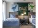Bedroom with dinosaur wall decorations and dual beds at 12017 Grinstead Ln # 301, Charlotte, NC 28278