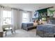 Bedroom with dinosaur wall decorations, dual beds, and natural light from the windows at 12017 Grinstead Ln # 301, Charlotte, NC 28278