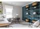 Bright home office featuring a desk, shelves, and large window for natural light at 12017 Grinstead Ln # 301, Charlotte, NC 28278