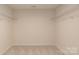 Spacious walk-in closet with wire shelving at 12017 Grinstead Ln # 301, Charlotte, NC 28278