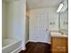 Fresh bathroom featuring a soaking tub and shower with glass doors at 12713 Frank Wiley Ln, Charlotte, NC 28278