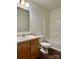 Cozy bathroom featuring a single sink vanity, toilet, and tub with shower at 12713 Frank Wiley Ln, Charlotte, NC 28278