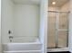 Fresh bathroom featuring a soaking tub and shower with glass doors at 12713 Frank Wiley Ln, Charlotte, NC 28278