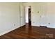 Cozy bedroom with multiple access doors and durable flooring at 12713 Frank Wiley Ln, Charlotte, NC 28278