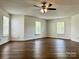 Spacious room with modern ceiling fan, and natural light from multiple windows at 12713 Frank Wiley Ln, Charlotte, NC 28278