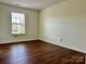 Comfortable bedroom featuring a large window that brings in an abundance of natural light at 12713 Frank Wiley Ln, Charlotte, NC 28278