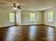 Spacious room with modern ceiling fan, and natural light from multiple windows at 12713 Frank Wiley Ln, Charlotte, NC 28278